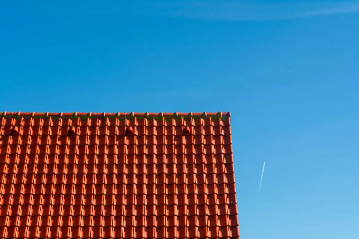 Tile roof gable in full sun, the kind of exposure that sets roof life in Del Rio, TX
